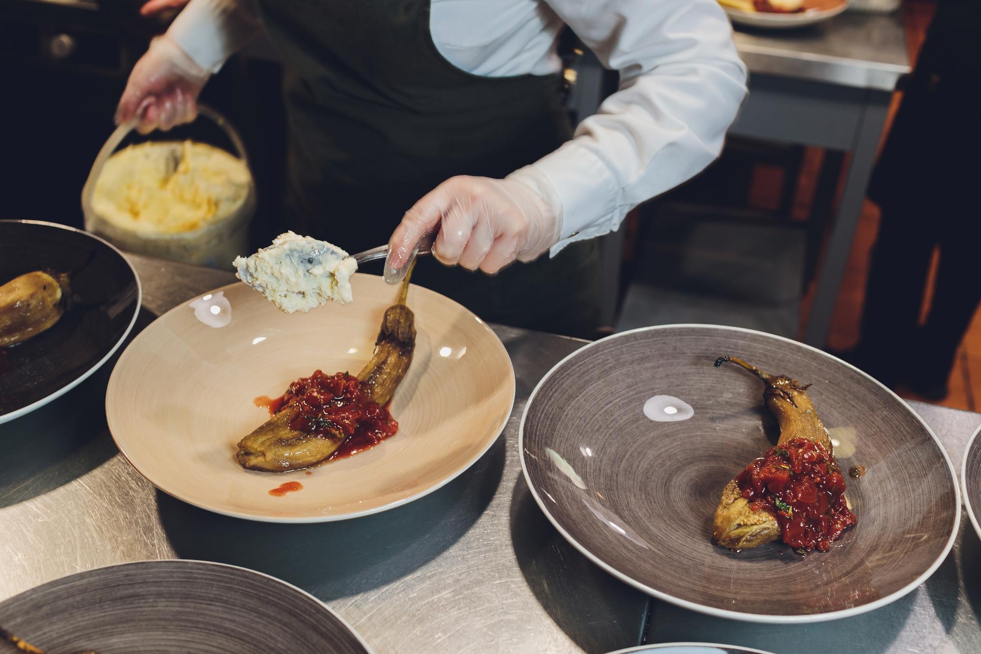 Chef demonstrating a plated dish